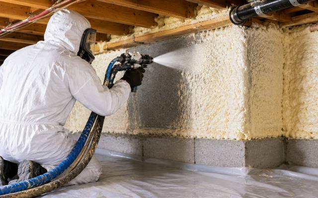 Foundation wall of a cottage sealed with closed cell foam from the ground sheet up